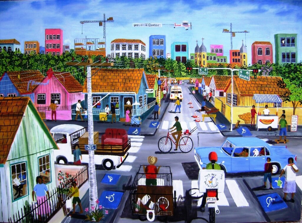 Pintura naïf de Marcelo Schimaneski intitulada "Resistindo a Modernidade". Cena urbana movimentada com rua cheia de pedestres, ciclistas, carros e ônibus, cercada por prédios e casas coloridas, com símbolos de acessibilidade visíveis no chão.